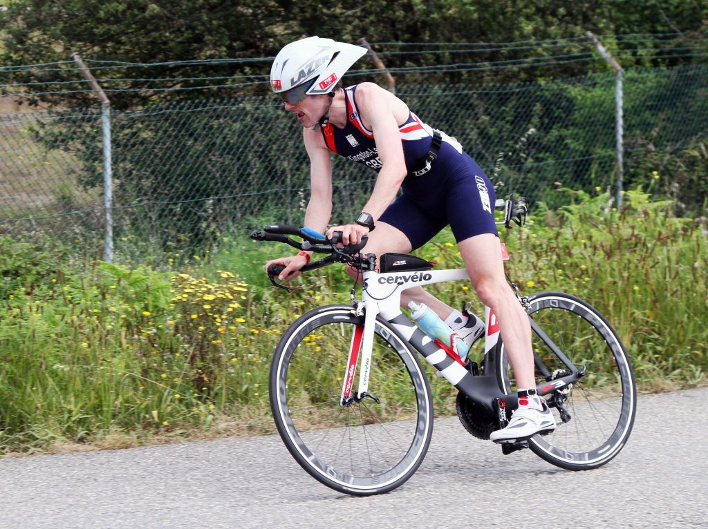 Still not in TT position. A fairly tight bend is my excuse this time... Picture c/o Assuming the 'stretch the arms and shoulders' position during the bike leg. Picture c/o  Pete Bracegirdle.